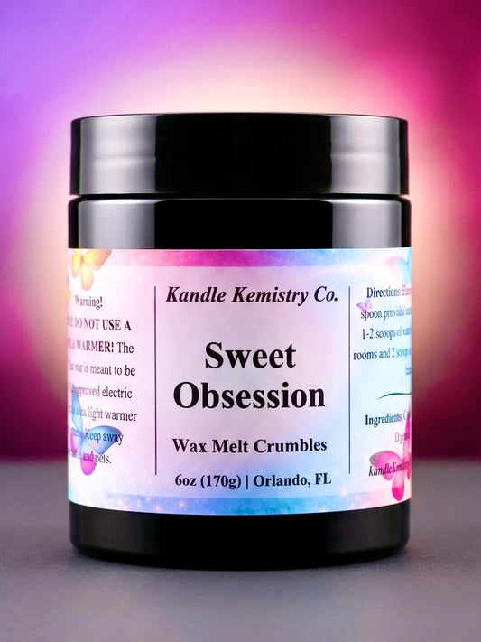 Jar of Kandle Kemistry Co. Sweet Obsession wax melt crumbles with a colorful label.