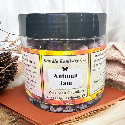 Jar of 'Autumn Jam' wax melt crumbles from Kandle Kemistry Co. on a neutral background.