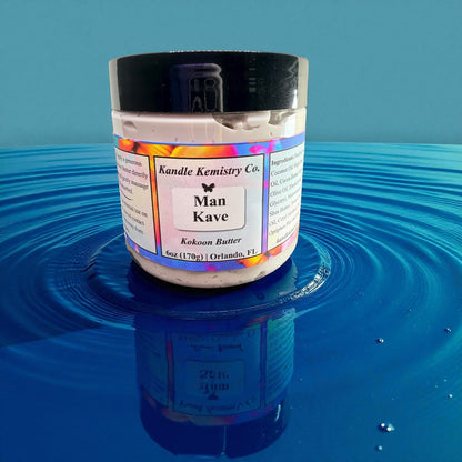 Jar of 'Man Kave' product by Kandle Kemistry Co. on a blue reflective surface