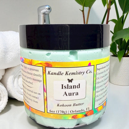 Jar of 'Island Aura' body butter from Kandle Kemistry Co. with a colorful label.