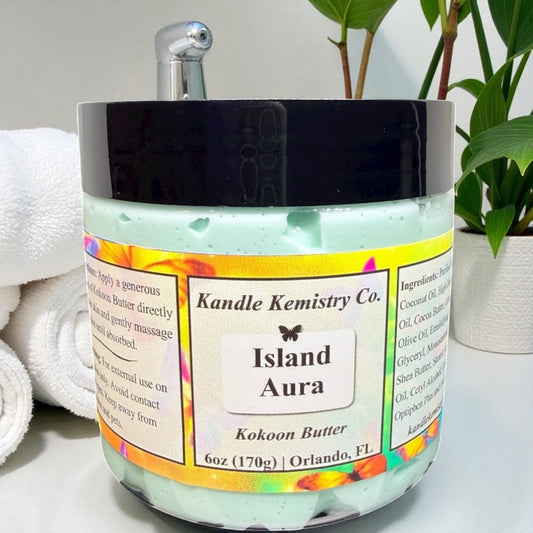 Jar of 'Island Aura' body butter from Kandle Kemistry Co. with a colorful label.