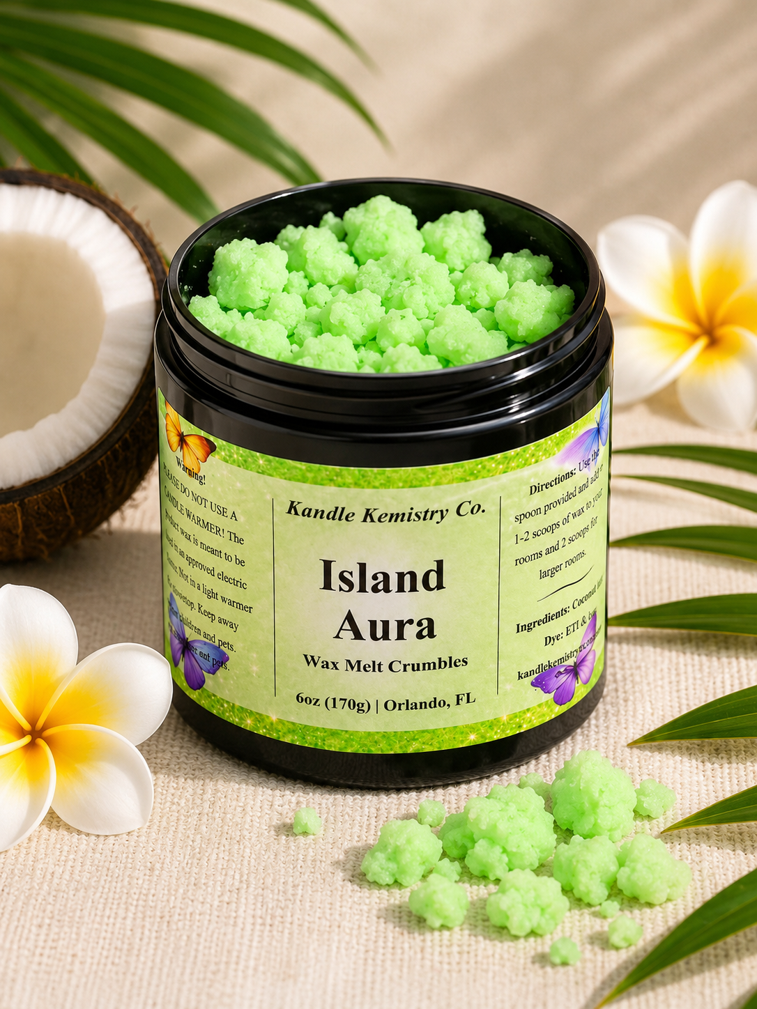 Island Aura wax melt crumbles in open jar with bright green crumbles, coconut and tropical flowers, Coconut Colada inspired scent by Kandle Kemistry Co.