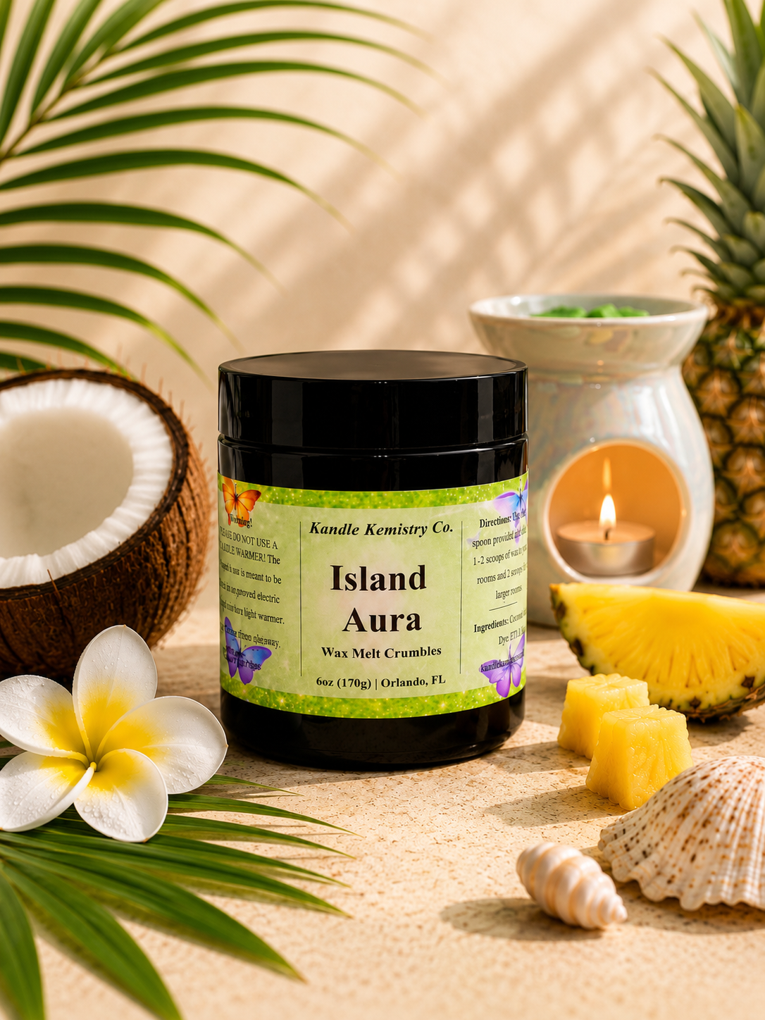 Island Aura wax melt crumbles with wax warmer in tropical setting, coconut and pineapple notes creating a soft luxury home fragrance