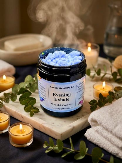 Jar of 'Evening Exhale' wax melt crumbles and towels on a table