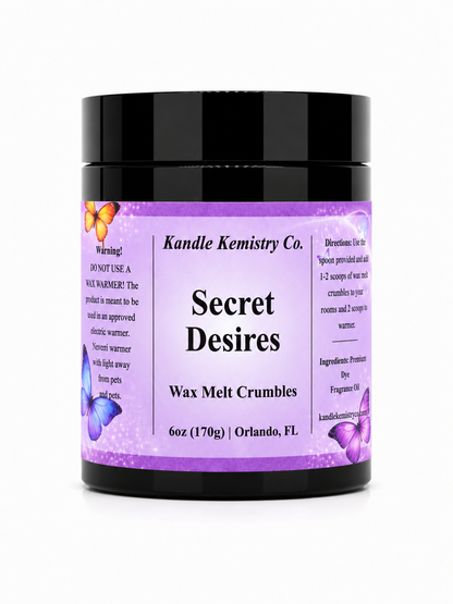A black plastic jar of Kandle Kemistry Co. Secret Desires Wax Melt Crumbles, featuring a lavender purple label with butterfly illustrations and white text, set against a plain white background.