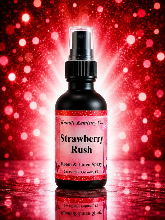 A bottle of Strawberry Rush Room & Linen Spray by Kandle Kemistry Co. The product is in a black glass bottle with a black spray pump and a pink and white label, set against a red and pink glittery bokeh background with a reflection below.