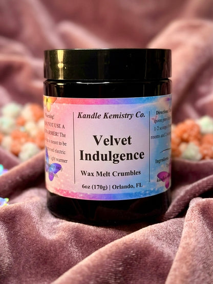 Jar of Kandle Kemistry Co. Velvet Indulgence wax melt crumbles on a textured surface.